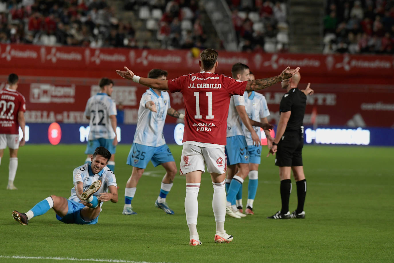 La derrota del Real Murcia frente al Málaga, en imágenes