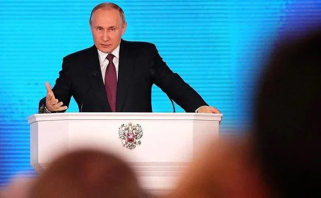 Vladimir Putin addresses the members of the Federal Assembly.