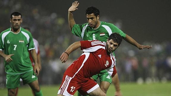 Imagen de un partido amistoso entre Palestina (rojo) e Irak (verde). 
