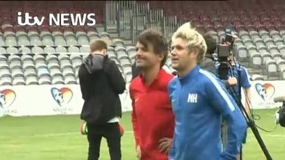 Louis Tomlinson y Niall Horan entrenando.