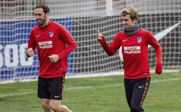 Godín y Griezmann, entrenando en el Atlético. 