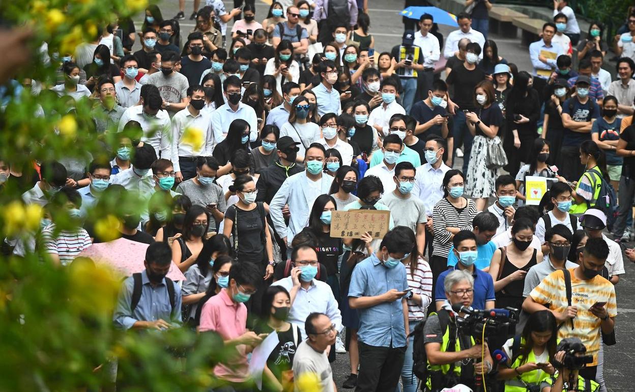Manifestación celebrada este viernes en el distrito financiero de Hong Kong.