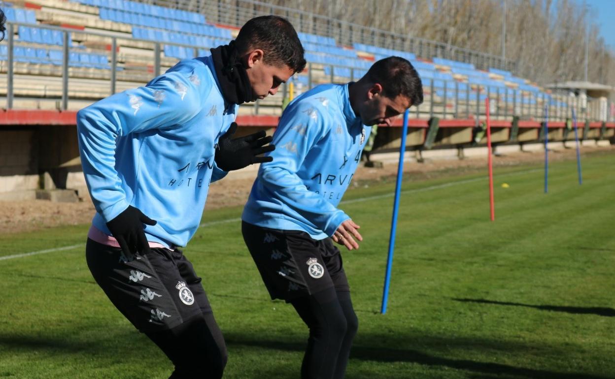 Buenacasa y Castañeda, en el entrenamiento de este jueves.