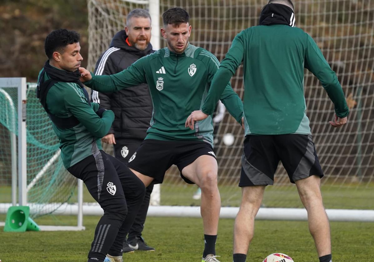 Markel y Bustos, en un entrenamiento de la Deportiva.