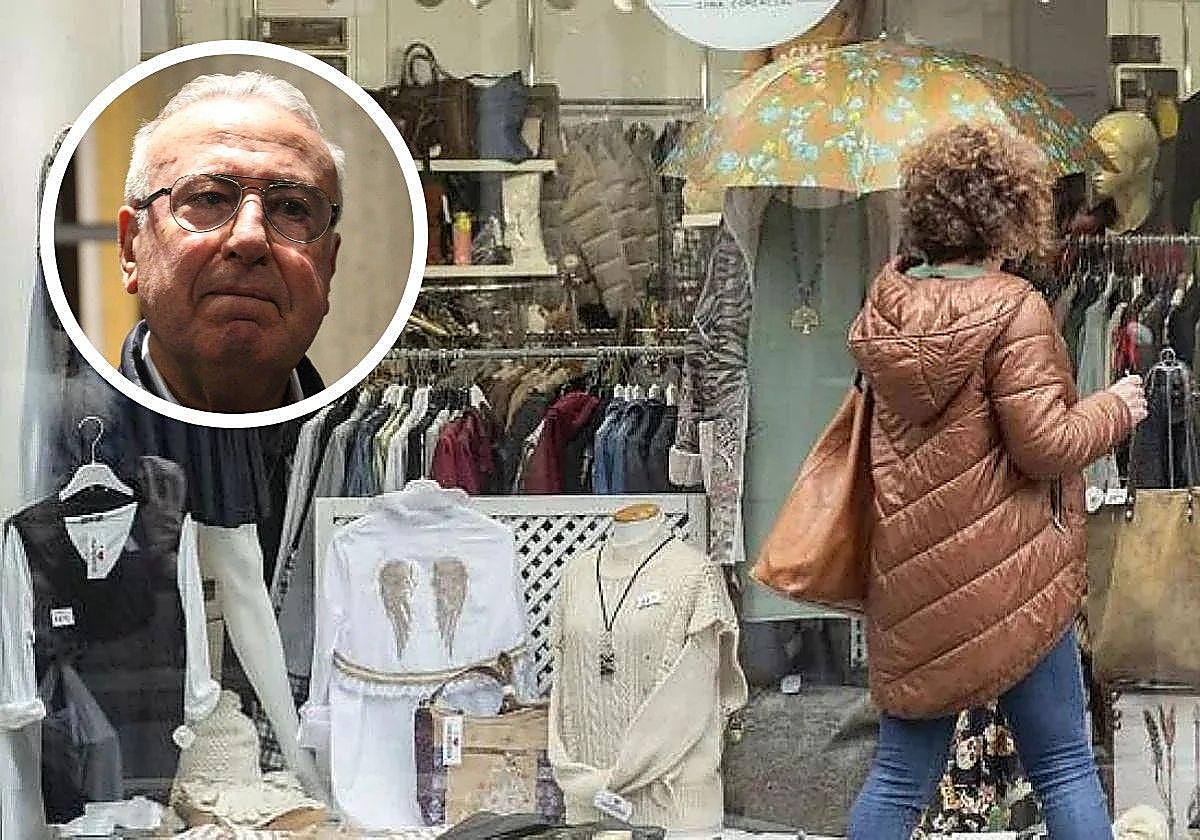 Alfredo Martínez y una persona mirando un escaparate.