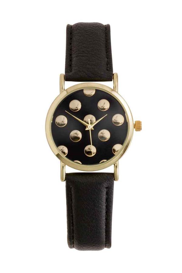 Reloj combinado de H&M en color dorado y negro, perfecto para esta temporada por 9,99 euros.