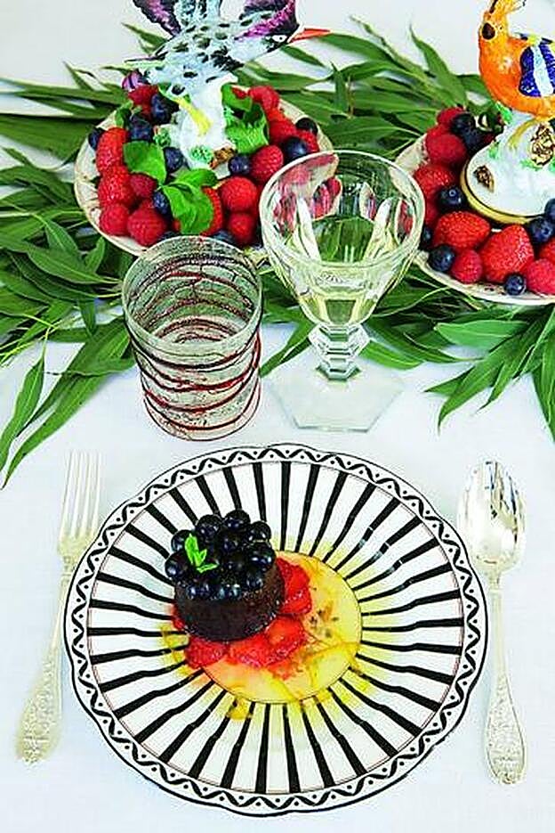 Moelleux de chocolate negro, jengibre y arándanos con naranja confitada.