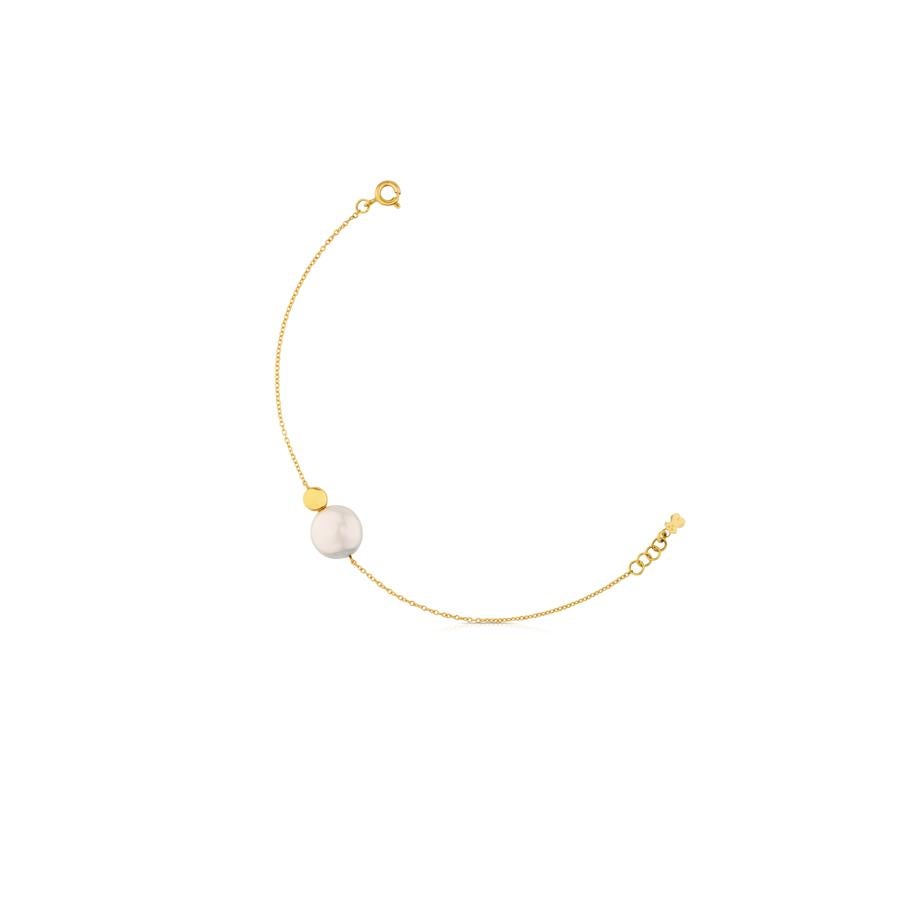 Esta es de oro amarillo de 18kt y tiene una perla