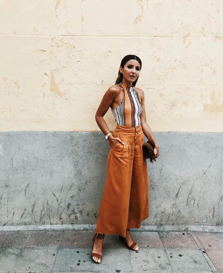 Alexandra Jiménez, más conocida como Lovely Pepa, con body de rayas y pantalón palazzo. ¿Qué te parece?