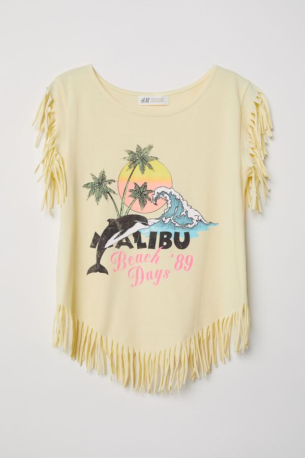 Con unos shorts, esta camiseta de H&M es perfecta para los largos días de playa... cuando lleguen
