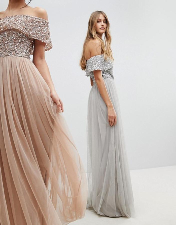 En gris humo o color champagne, con falda de tul e impresionante cuerpo joya con escote 'off the shoulder'. Precio del vestido de invitada: 121.99 euros en Asos.