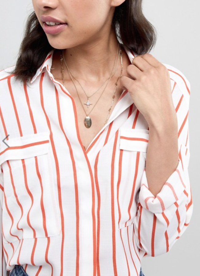 Collar con múltiples hileras con colgante de disco y estrella de cristal de Asos Design (8,99 euros).