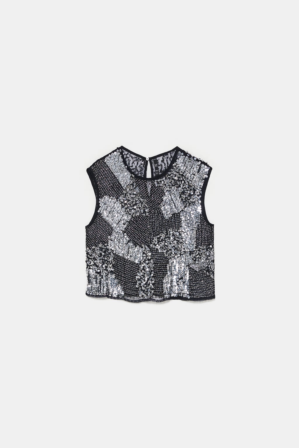 Cuerpo mini con mix de lentejuelas de Zara. (25,95 euros).