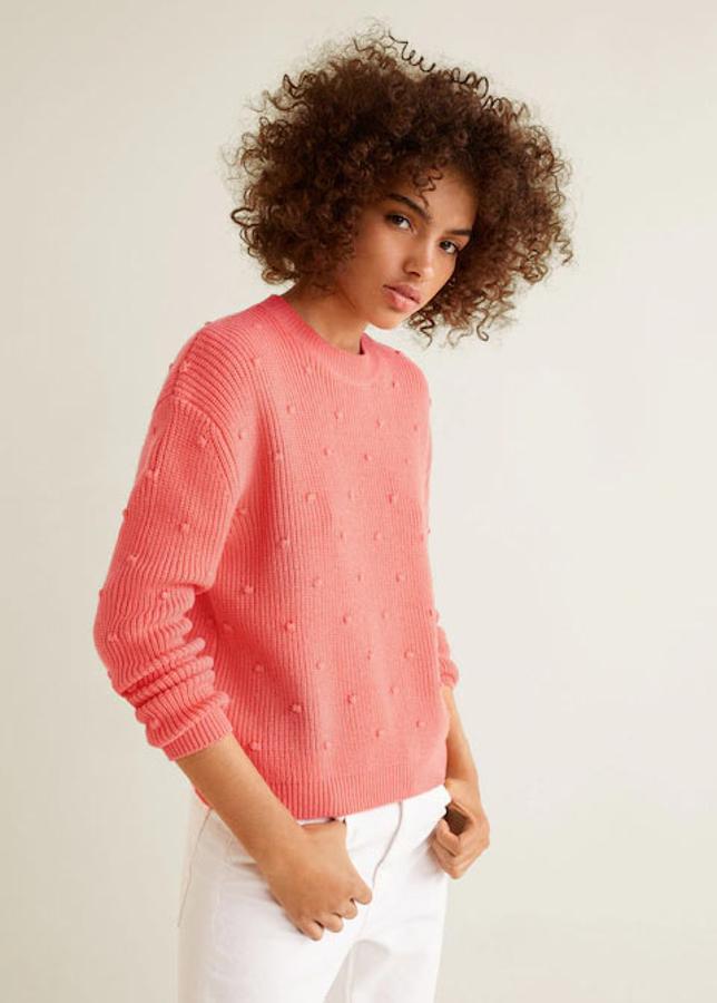 Jersey de punto con textura y borlas decorativas, 19,99 euros.