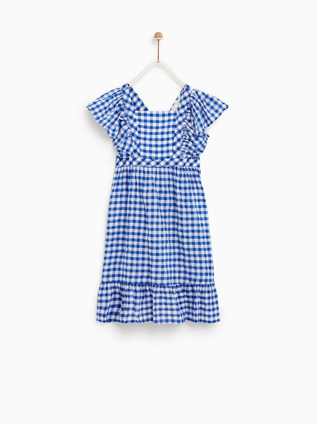 Vestido mini de cuadros en manga corta de Zara Kids: 15,99 euros.