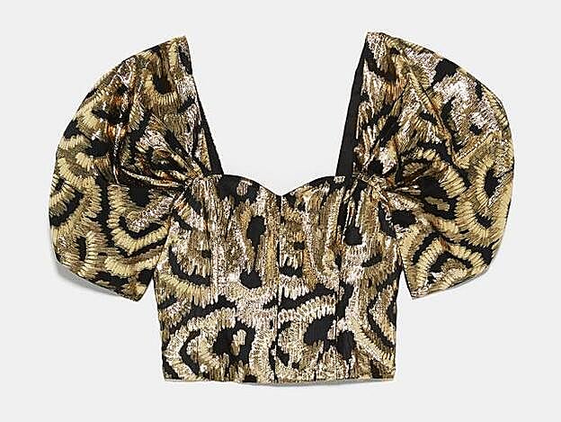 Top con manga abullonada y detalle de hilo metalizado, 39,95 euros.