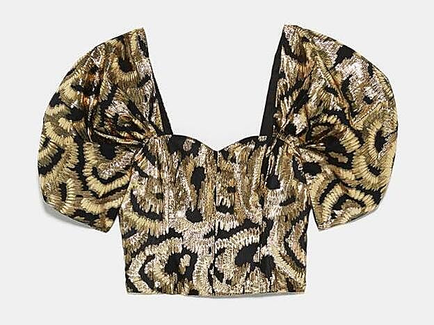 Top con hilo metalizado y mangas abullonadas, 39,95 euros.