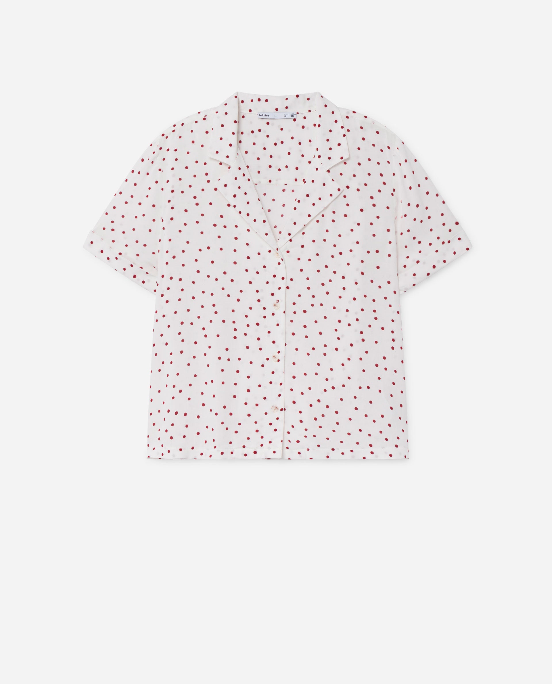 Blusa blanca con estampado de lunares para elevar los jeans a otro nivel. (9,99 euros).