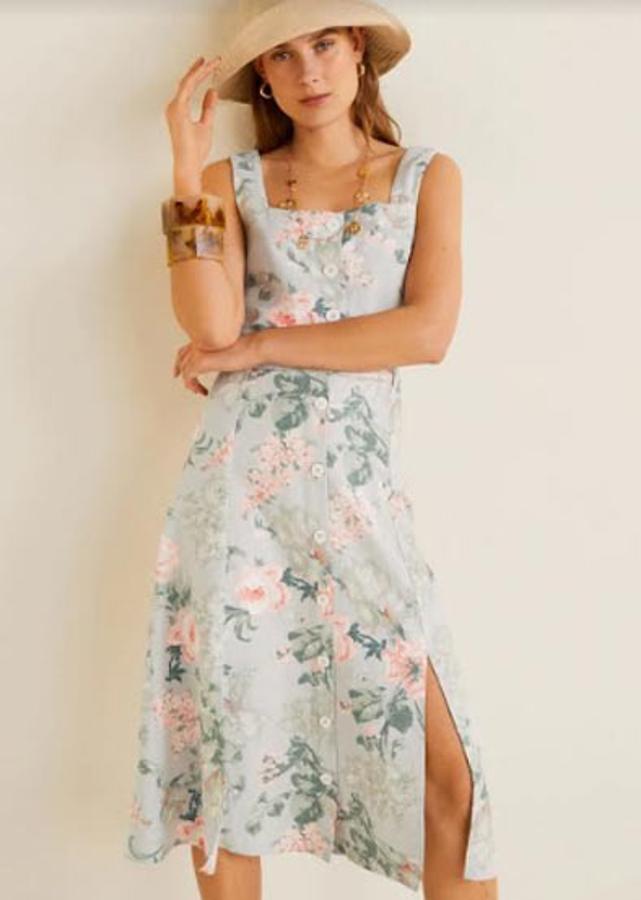 Falda midi con estampado floral, cierre de botones en la parte delantera y aberturas laterales, 12,99 euros.