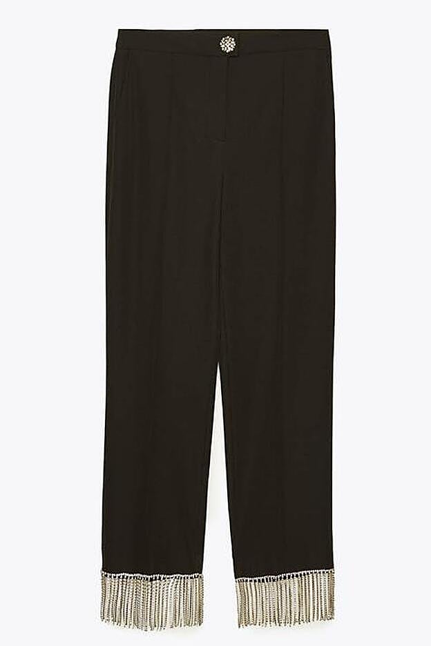 Pantalón de Uterqüe con el bajo adornado con tiras de strass (199 euros).