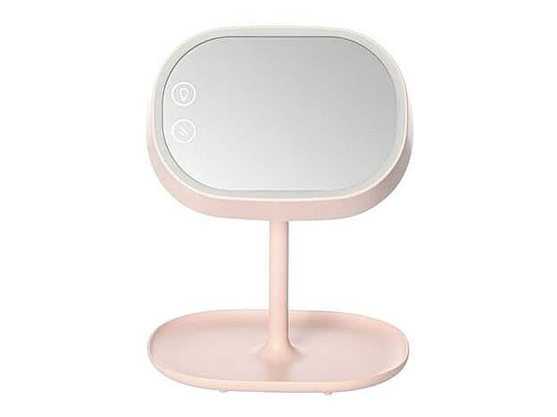 Este espejo en rosa millenial se convierte en lámpara si lo rotas.