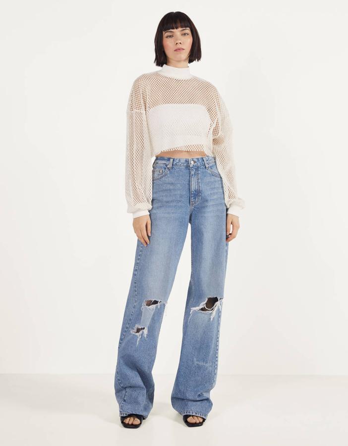 Jeans flare con rotos (29,99 euros).