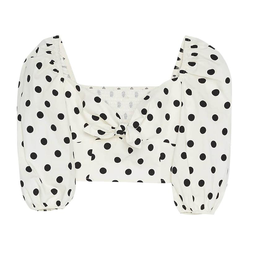 Top cropped con lazo en el escote y mangas abullonadas, 19,99 euros.