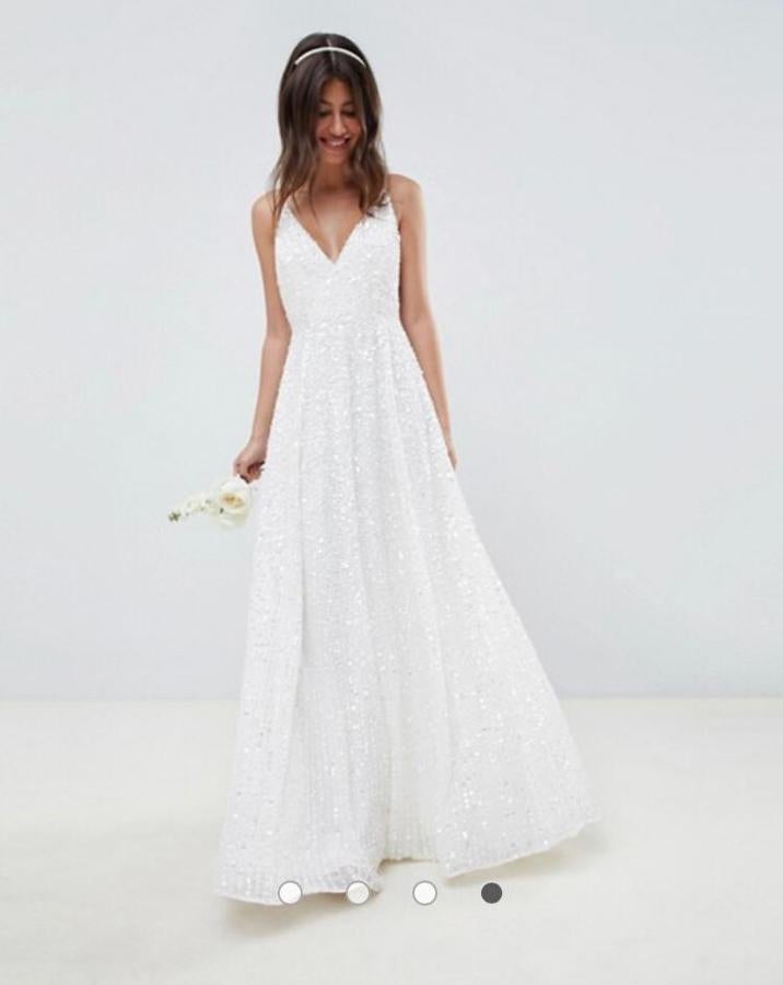 Vestido de boda de tirantes con lentejuelas de ASOS EDITION (248,99 euros), disponible  aquí .