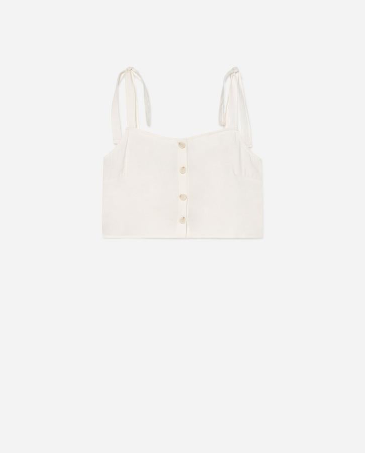 Top blanco con lazada en los tirantes de Lefties, (4,99 euros).