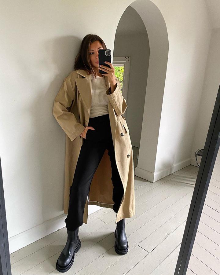 Las gabardinas -ficha  las más baratas y bonitas de la temporada - son la prenda de abrigo ideal para llevar en eltretiempo y dar un toque de estilo diferente a tu look. Combinada con las botas del momento puedes conseguir outfits tan ponibles como este de Marianne.