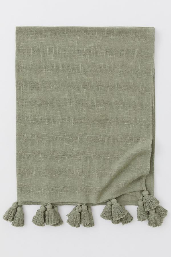 Fotos: 9 mantitas gustosas para atrincherarte en el sofá que además decoran tu salón