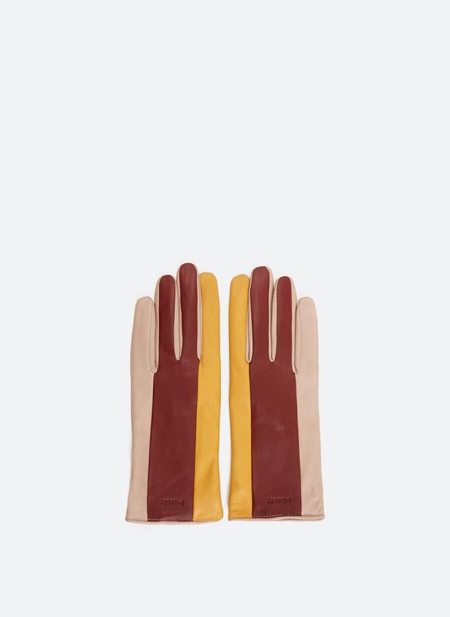 Diseño tricolor en rojo, amarillo y rosa maquillaje para estos guantes de piel de alta calidad de Uterqüe que podemos encontrar en las tallas S y M por 59 euros.