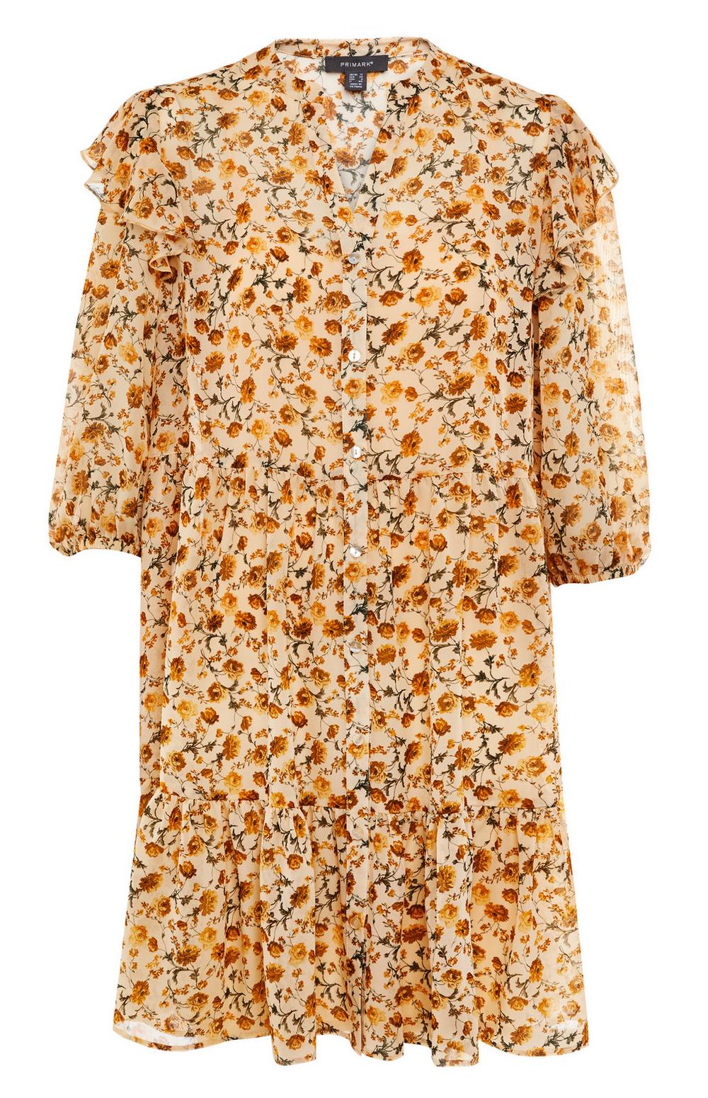 Este mini vestido romántico amarillo suave con flores en tonos ocre y mostaza es de Primark y cuesta 16 euros.