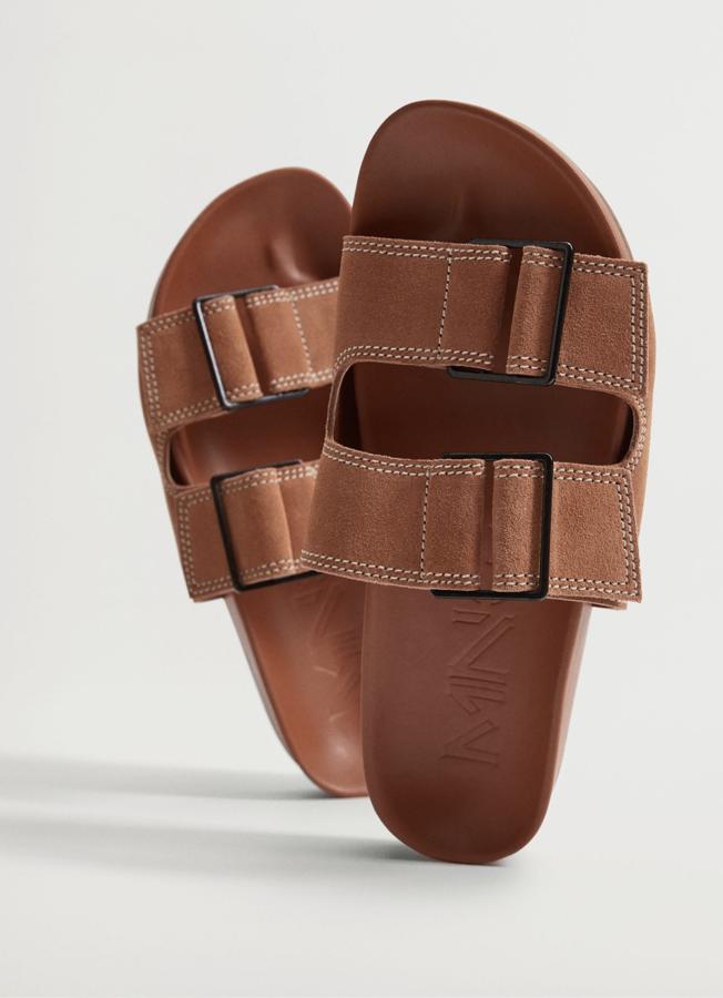 Disponible en marrón o en naranja tostado, esta sandalia de piel con diseño de tiras y costuras en contraste tiene un precio rebajado de 19,99 euros (antes 39,99 euros).