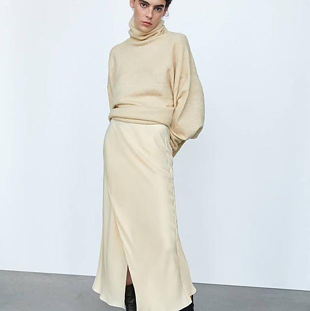 Imagen principal - Las faldas midi satinadas más elegantes para tus looks con jersey y botas esta temporada