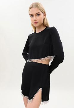 Imagen secundaria 2 - Ni vestido de lentejuelas ni de terciopelo: el look de Navidad más especial (y barato) es este original conjunto de Lefties con el que serás la mejor vestida