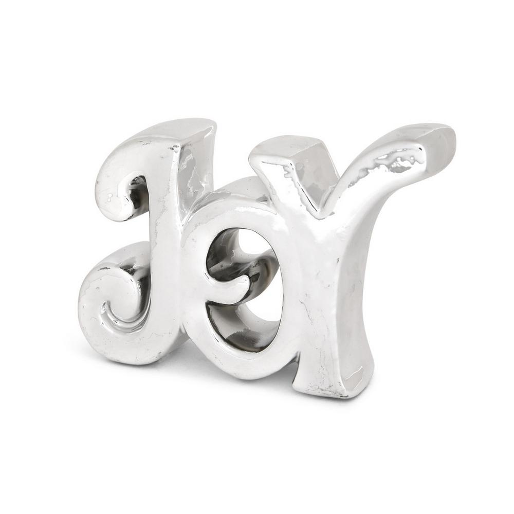 Este adorno plateado con la palabra Joy (diversión) podría estar en nuestra casa todo el año. Cuesta 2 euros en Primark Home.