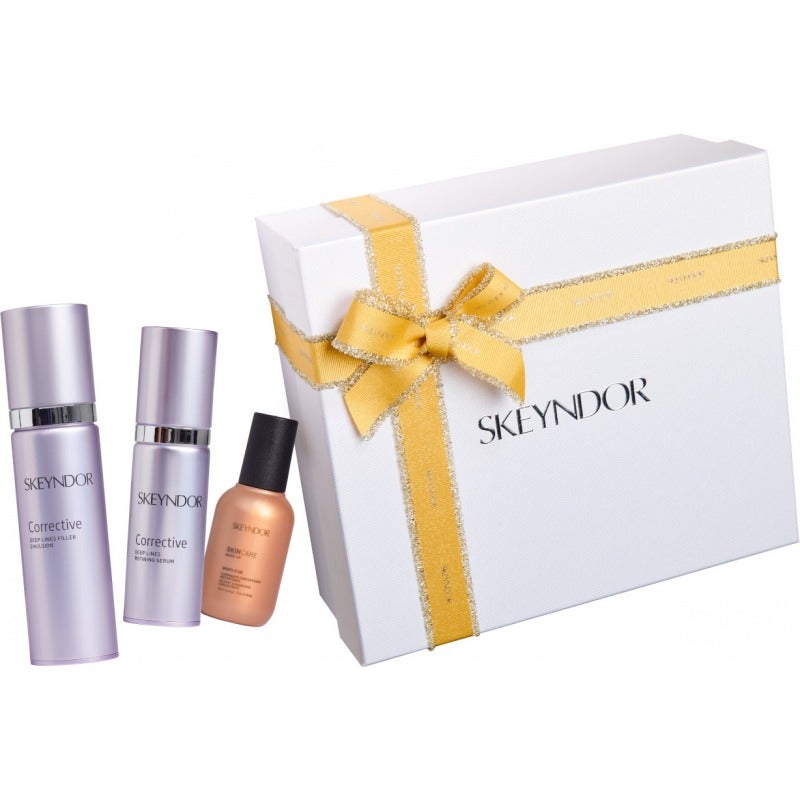 Cofre Corrective especial pieles mixtas / grasas de Skeyndor. Contiene la crema y el sérum de Corrective, un perfecto dúo para combatir el envejecimiento, junto con el nuevo Drops D’Or, un iluminador concentrado instantáneo con pigmentos dorados para brillar esta Navidad. (99 euros).