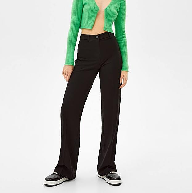 Imagen principal - Los pantalones que necesitas para mejorar tus looks de oficina son estos de traje cómodos y elegantes super low cost