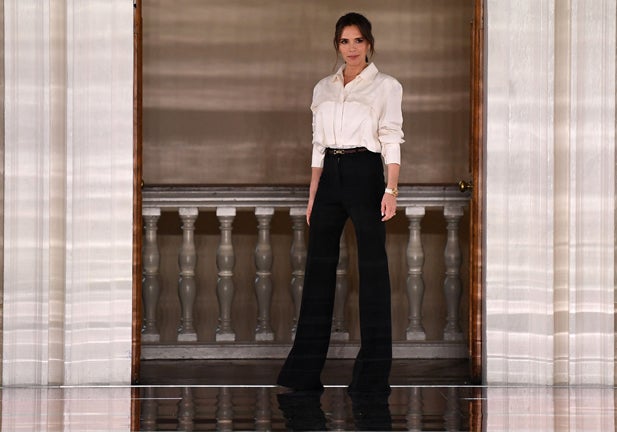 British fashion designer Victoria Beckham reacts after presenting creations for her Autumn/Winter 2020 collection on the third day of London Fashion Week in London on February 16, 2020. (Photo by Daniel LEAL / AFP) (Photo by DANIEL LEAL/AFP via Getty Images)
