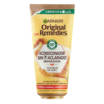 Imagen secundaria 1 - Nuestros productos recomendados para un corte de pelo pixie: Acondicionador sin aclarado Tesoros de Miel de Garnier (4,95 €) y Spray Protección y Prevención de Moroccanoil (32 €).