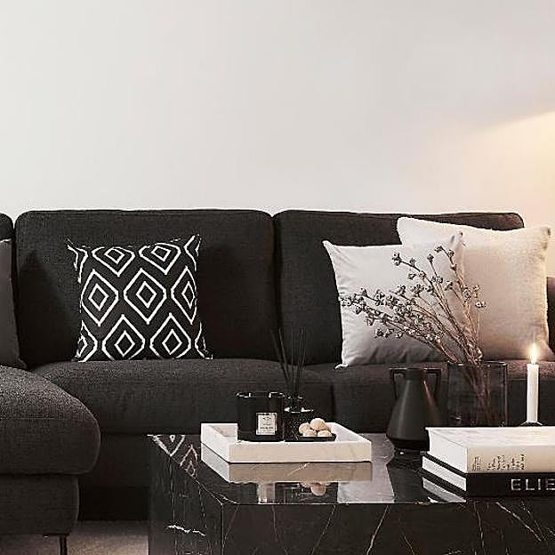 La funda de cojín con rombos para salones modernos.