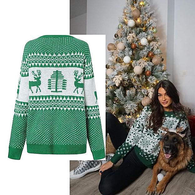 Estela grande cin un jersey verde navideño.