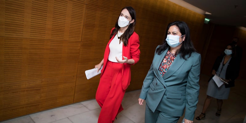 WELLINGTON, NEW ZEALAND - MARCH 23:  Prime Minister Jacinda Ardern and Associate Health Minister Ayesha Verrall arrive ahead of their press conference to announce changes to COVID-19 Omicron vaccine and mandates rules at Parliament on March 23, 2022 in Wellington, New Zealand. Prime Minister Jacinda Ardern today announced some changes to New Zealand's COVID-19 response and restrictions following a National cabinet meeting. New Zealand's traffic light system of restrictions will remain in place to help manage any future COVID-19 outbreaks, but rules have been eased somewhat with number limits on all outdoor gatherings now removed. Indoor gathering limits will increase from 100 to 200 under the red light setting. (Photo by Robert Kitchin - Pool/Getty Images)