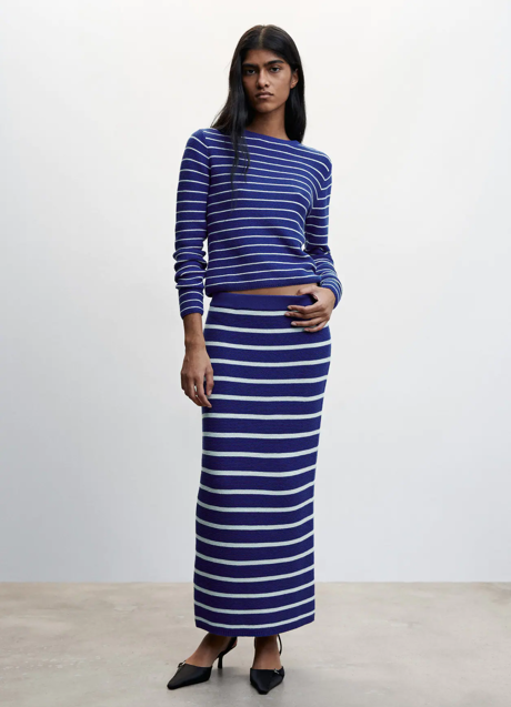 Imagen - Conjunto de falda y jersey de Mango (falda 29,99€; jersey 29,99€).