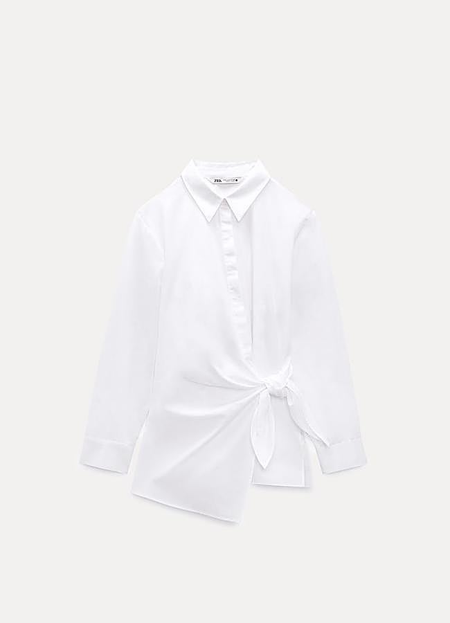 Imagen - Camisa blanca con nudo de Zara (29,95 euros).