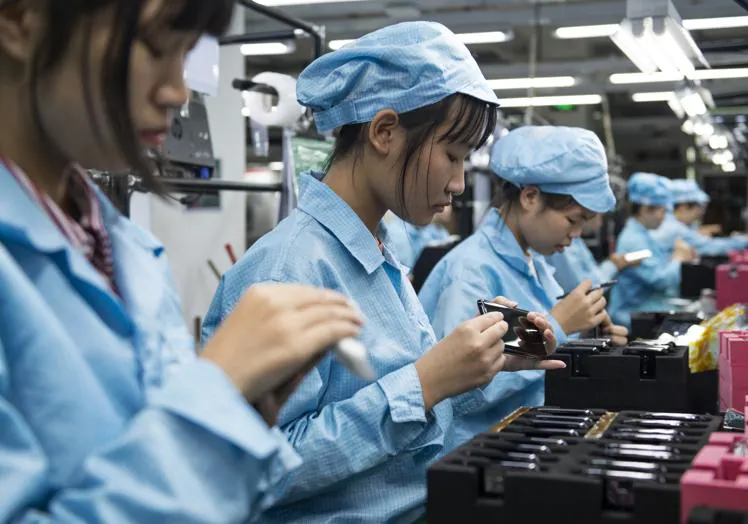 Workers in a factory of the Oppo mobile brand.