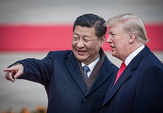 Xi Jinping con Donald Trump en una ceremonia en Beijing.
