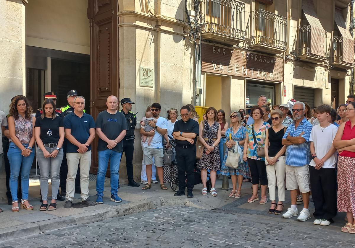 A hundred people observed a minute's silence for the child who died in a car during a heatwave.