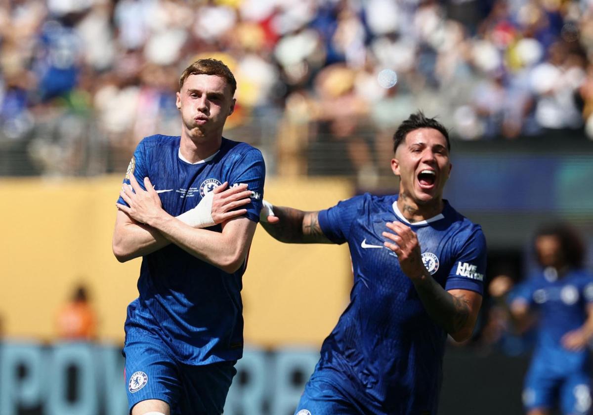 Cole Palmer celebrates with Enzo Fernández after scoring one of his two goals against PSG.
